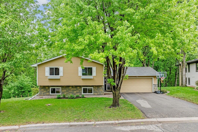 112115 Haering Cir, Chaska, MN 55315 - split level home with asphalt driveway, a front lawn, and a garage