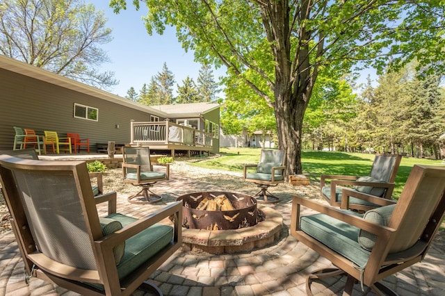 2510 Conifer Ave, Alexandria, MN 56308 - view of patio featuring a fire pit and a deck