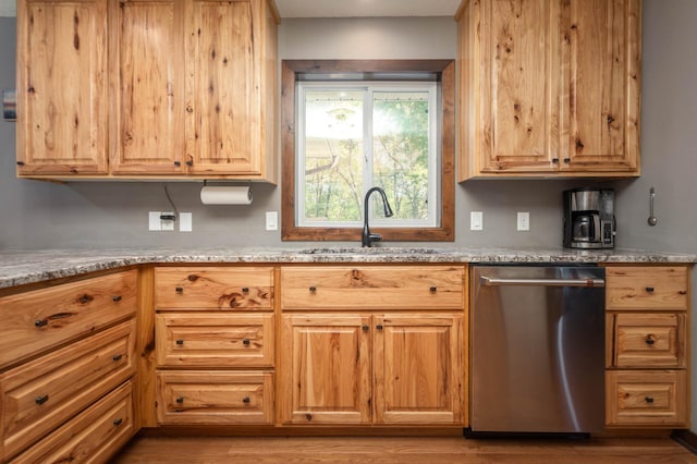 2510 Conifer Ave, Alexandria, MN 56308 - kitchen featuring stainless steel dishwasher, a sink, and light wood-type flooring