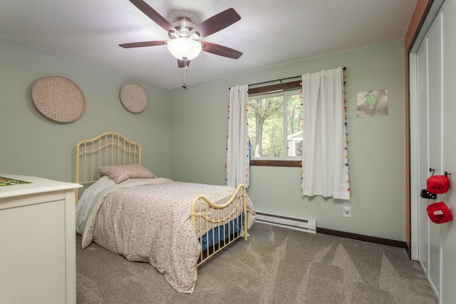 2510 Conifer Ave, Alexandria, MN 56308 - bedroom with baseboard heating, carpet floors, baseboards, ceiling fan, and a closet