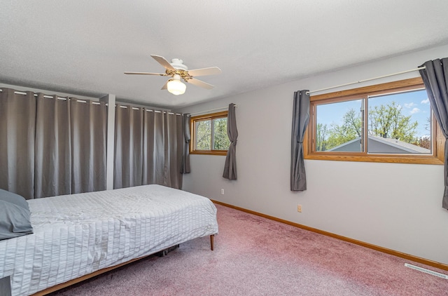 6872 Grenwich Ln N Unit 0, Oakdale, MN 55128 - carpeted bedroom with baseboards and ceiling fan