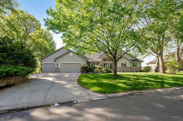 14573 Krypton St NW, Ramsey, MN 55303 - view of front of home featuring concrete driveway, a garage, and a front lawn