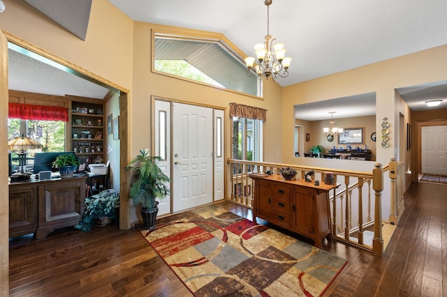 14573 Krypton St NW, Ramsey, MN 55303 - foyer entrance with a chandelier, hardwood / wood-style flooring, and high vaulted ceiling