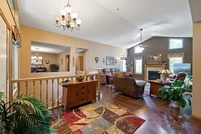 14573 Krypton St NW, Ramsey, MN 55303 - living area featuring a chandelier, vaulted ceiling, a fireplace, hardwood / wood-style floors, and ceiling fan