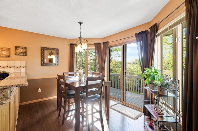 14573 Krypton St NW, Ramsey, MN 55303 - dining area with dark wood finished floors and baseboards