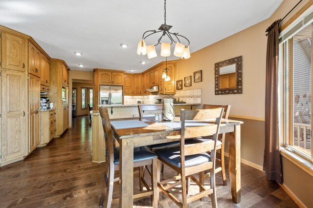 14573 Krypton St NW, Ramsey, MN 55303 - dining room featuring dark wood-type flooring, a chandelier, recessed lighting, and baseboards