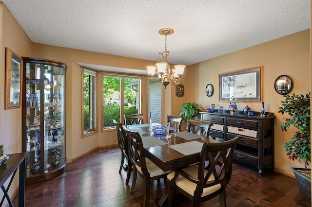 14573 Krypton St NW, Ramsey, MN 55303 - dining room with a chandelier, a textured ceiling, dark wood finished floors, and baseboards