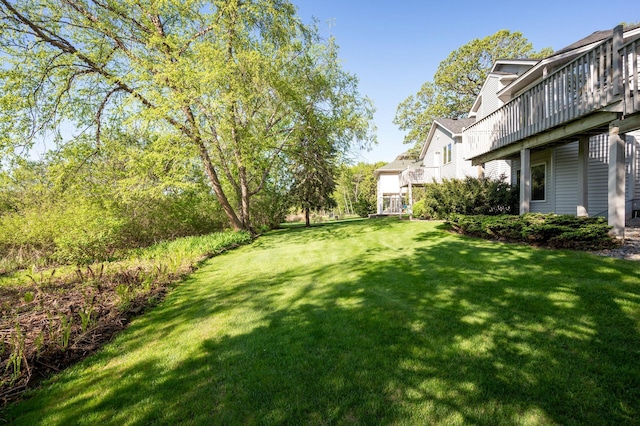 14573 Krypton St NW, Ramsey, MN 55303 - view of green lawn featuring a deck