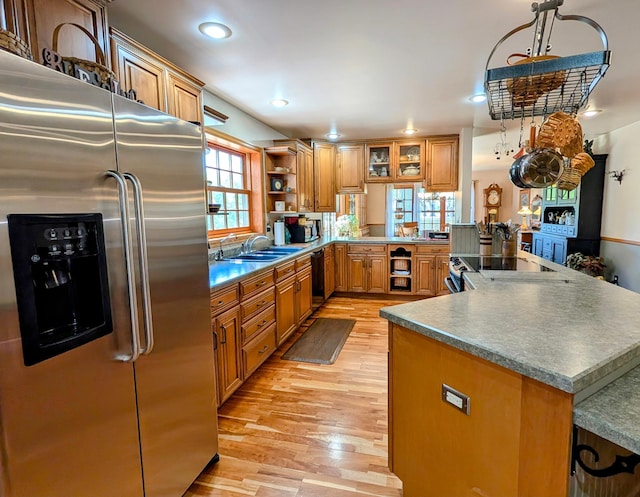 617 9th St, Montevideo, MN 56265 - kitchen featuring high end refrigerator, a sink, dishwasher, light wood-style floors, and open shelves