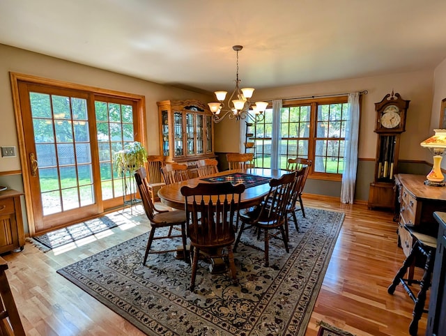 617 9th St, Montevideo, MN 56265 - dining room with a chandelier and light wood-style flooring