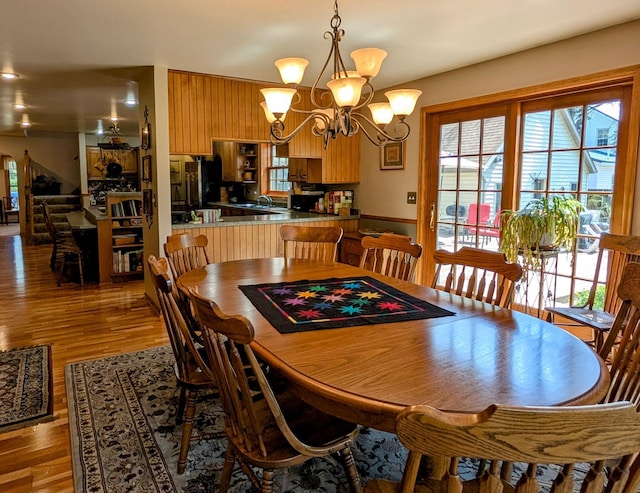 617 9th St, Montevideo, MN 56265 - dining room with wood finished floors and a chandelier