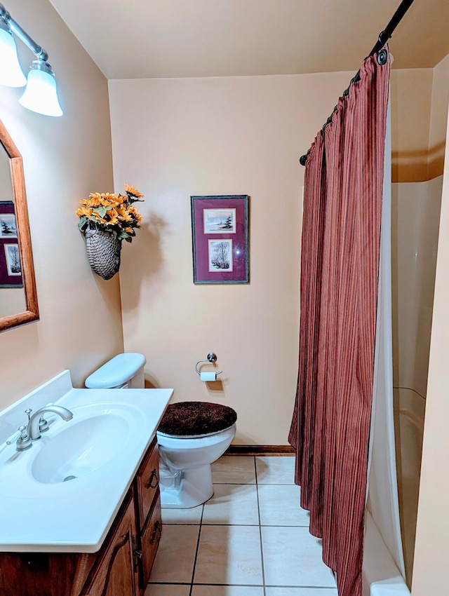 617 9th St, Montevideo, MN 56265 - bathroom featuring toilet, tile patterned flooring, vanity, and a shower with curtain