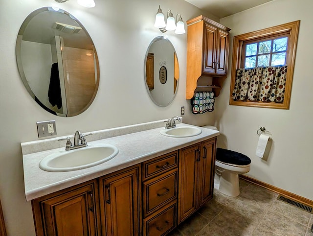 617 9th St, Montevideo, MN 56265 - full bathroom with toilet, baseboards, and double vanity