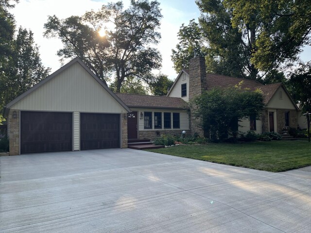617 9th St, Montevideo, MN 56265 - view of front of property with a front lawn, stone siding, and a chimney