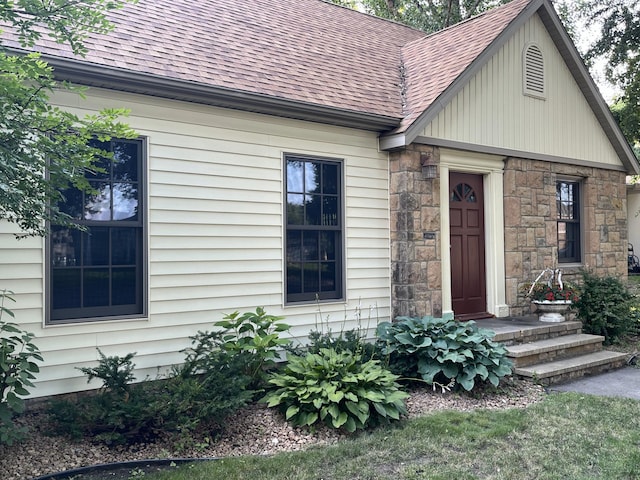 617 9th St, Montevideo, MN 56265 - view of front of home featuring roof with shingles and stone siding