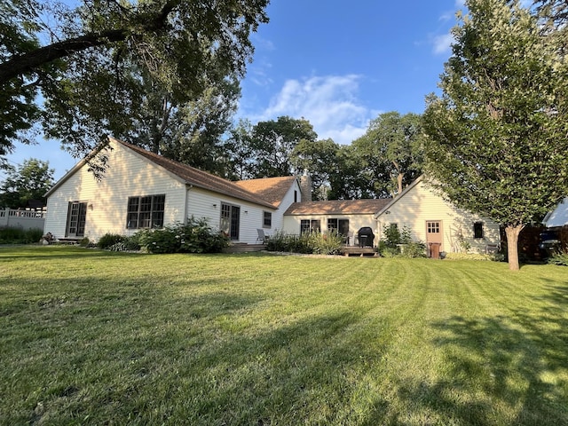 617 9th St, Montevideo, MN 56265 - view of front of property featuring a front yard and a chimney