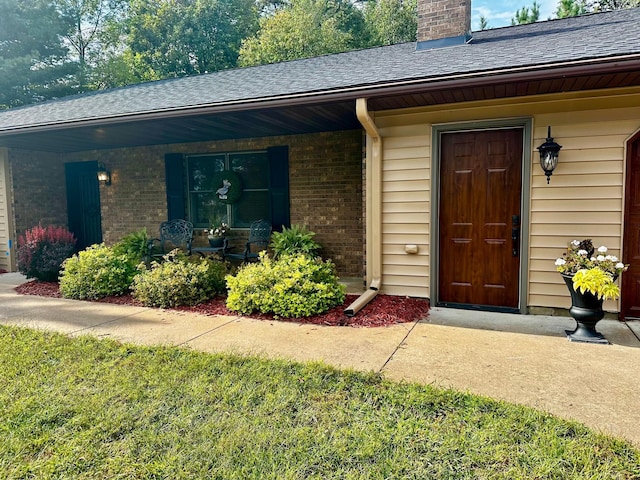 30703 Lakeview Dr, Breezy Point, MN 56472 - doorway to property featuring a porch, brick siding, a shingled roof, and a chimney