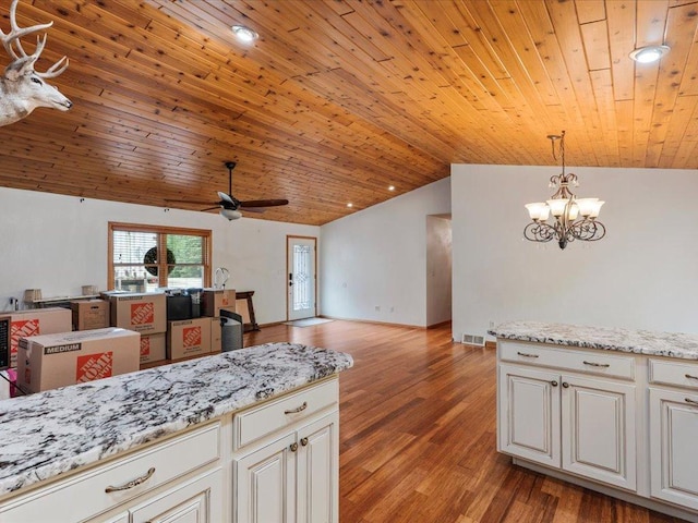 30703 Lakeview Dr, Breezy Point, MN 56472 - kitchen featuring vaulted ceiling, ceiling fan, a chandelier, decorative light fixtures, and open floor plan