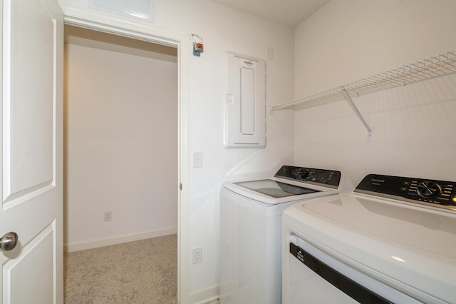 clothes washing area featuring electric panel, independent washer and dryer, carpet, and baseboards