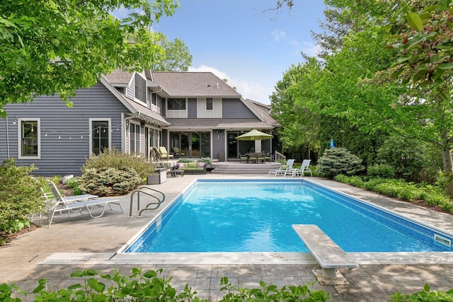 154 Babcock Ln, Wayzata, MN 55391 - outdoor pool with a patio area and a diving board