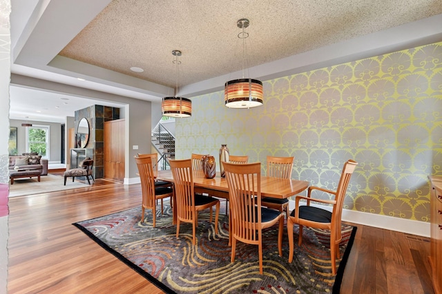 154 Babcock Ln, Wayzata, MN 55391 - dining room with wallpapered walls, stairs, baseboards, and wood finished floors