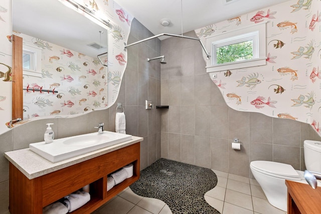 154 Babcock Ln, Wayzata, MN 55391 - full bath featuring toilet, tile walls, a tile shower, vanity, and tile patterned flooring