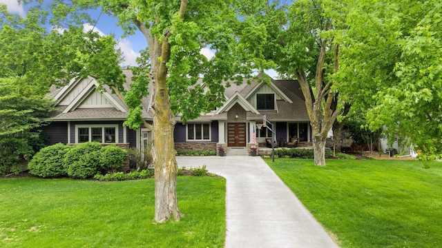 154 Babcock Ln, Wayzata, MN 55391 - view of front of home featuring french doors, a front lawn, board and batten siding, and concrete driveway