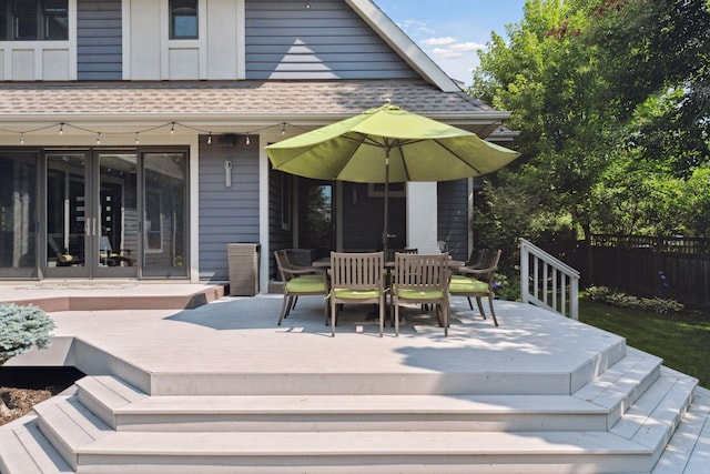 154 Babcock Ln, Wayzata, MN 55391 - wooden terrace with french doors and outdoor dining area