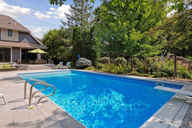 154 Babcock Ln, Wayzata, MN 55391 - view of pool with a diving board, a patio, and outdoor dining space