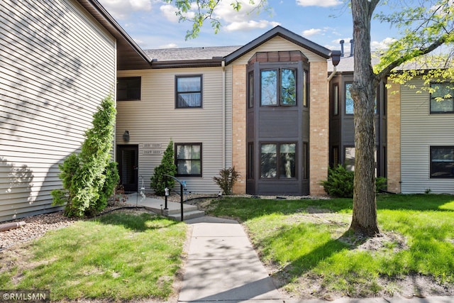 11031 Oregon Cir Unit 58, Bloomington, MN 55438 - view of property with a front yard and brick siding