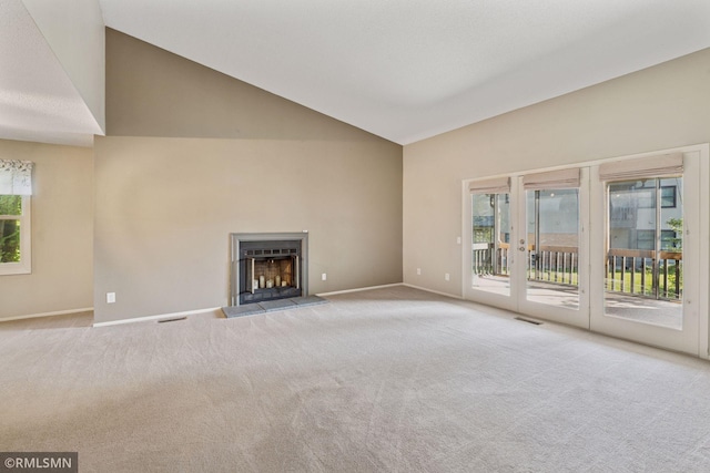 11031 Oregon Cir Unit 58, Bloomington, MN 55438 - unfurnished living room featuring carpet floors, baseboards, plenty of natural light, and high vaulted ceiling