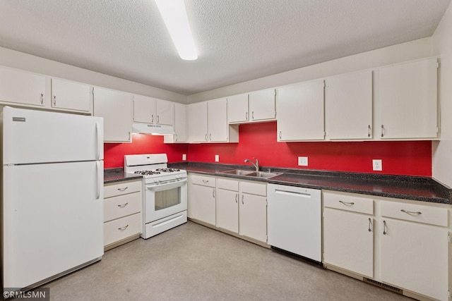 11031 Oregon Cir Unit 58, Bloomington, MN 55438 - kitchen featuring white appliances, a sink, under cabinet range hood, dark countertops, and a textured ceiling