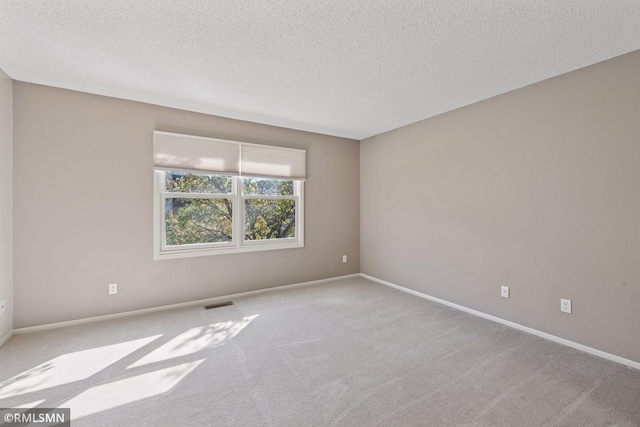 11031 Oregon Cir Unit 58, Bloomington, MN 55438 - carpeted spare room featuring a textured ceiling and baseboards