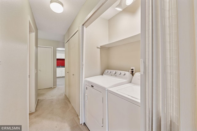 11031 Oregon Cir Unit 58, Bloomington, MN 55438 - clothes washing area with washing machine and clothes dryer and light colored carpet