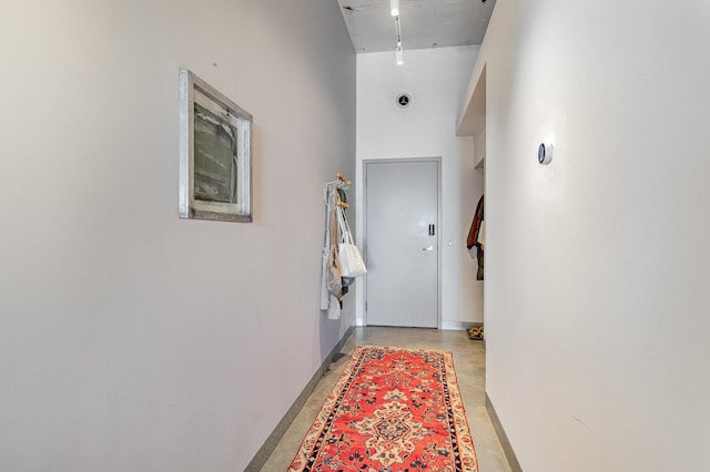 730 Stinson Blvd Unit 406, Minneapolis, MN 55413 - entryway featuring baseboards, a high ceiling, and concrete floors