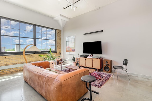 730 Stinson Blvd Unit 406, Minneapolis, MN 55413 - living room featuring concrete floors and brick wall