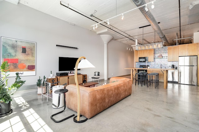730 Stinson Blvd Unit 406, Minneapolis, MN 55413 - living area with finished concrete floors and ornate columns
