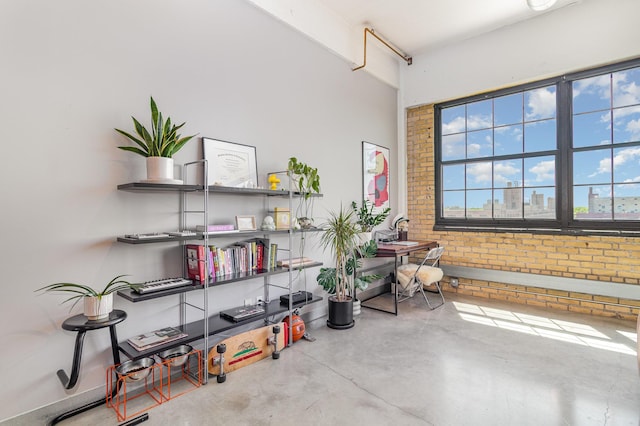 730 Stinson Blvd Unit 406, Minneapolis, MN 55413 - miscellaneous room featuring concrete flooring and brick wall