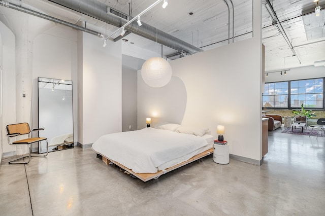 730 Stinson Blvd Unit 406, Minneapolis, MN 55413 - bedroom featuring concrete floors and a high ceiling