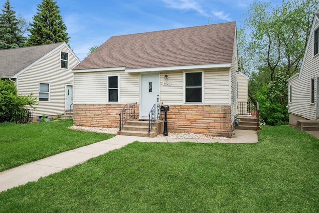 5921 Xerxes Ave S, Minneapolis, MN 55410 - view of front facade featuring stone siding, roof with shingles, and a front yard