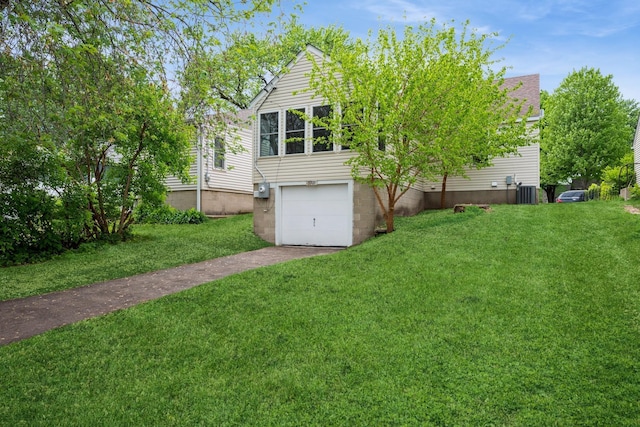 5921 Xerxes Ave S, Minneapolis, MN 55410 - view of green lawn with driveway, an attached garage, and central air condition unit