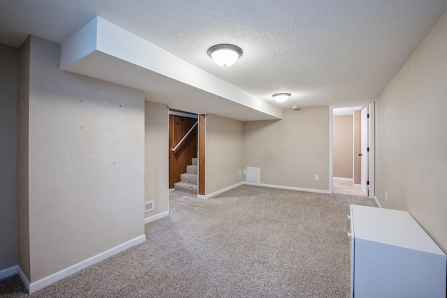 5921 Xerxes Ave S, Minneapolis, MN 55410 - finished below grade area with a textured ceiling, light carpet, stairway, and baseboards
