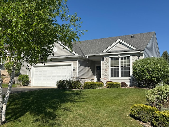 1675 Skywood Ln, Eagan, MN 55122 - view of front facade featuring stone siding, an attached garage, a front lawn, and a shingled roof