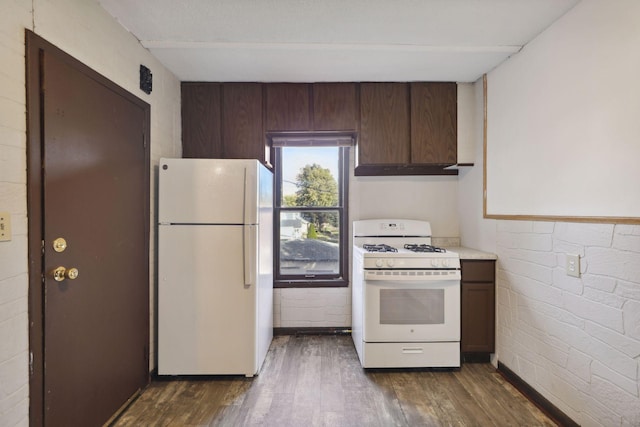 1264 Snelling Ave N, Saint Paul, MN 55108 - kitchen featuring white appliances, dark wood-style floors, light countertops, and exhaust hood