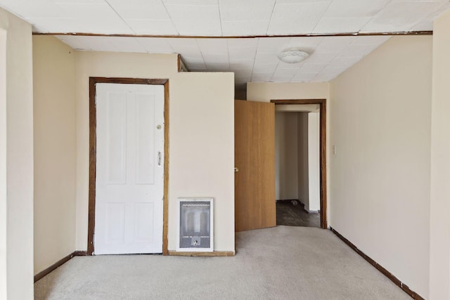 1264 Snelling Ave N, Saint Paul, MN 55108 - spare room featuring heating unit, light carpet, a smoke detector, and baseboards