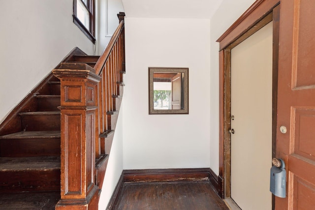 1264 Snelling Ave N, Saint Paul, MN 55108 - stairs with wood finished floors and baseboards