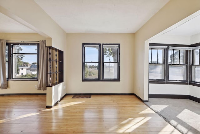 1264 Snelling Ave N, Saint Paul, MN 55108 - spare room with plenty of natural light, light wood-type flooring, and baseboards