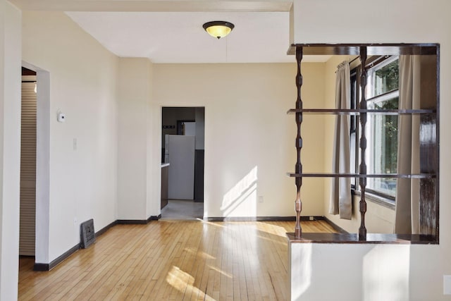 1264 Snelling Ave N, Saint Paul, MN 55108 - spare room with baseboards and hardwood / wood-style floors