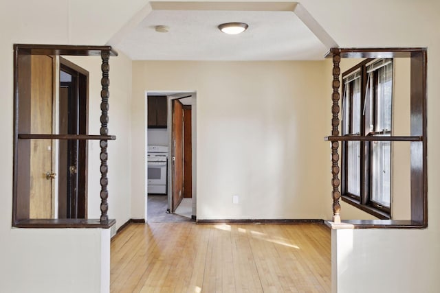 1264 Snelling Ave N, Saint Paul, MN 55108 - unfurnished room featuring hardwood / wood-style floors and baseboards