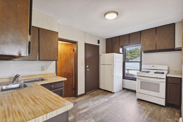 1264 Snelling Ave N, Saint Paul, MN 55108 - kitchen featuring white appliances, a sink, dark wood-style floors, a textured ceiling, and dark brown cabinetry